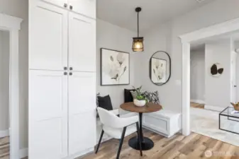 Kitchen view showing the white shaker Pantry cabinets and custom built-in breakfast nook & storage benches.