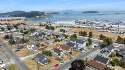 Drone view of the home, showing vicinity to Fidalgo Bay and the Marina.