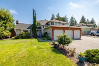 This beautiful home sits on a large corner lot with lots of parking.