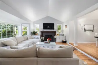 The living room has a gas fireplace and vaulted ceilings.