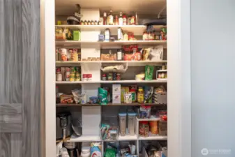 There is a newly added walk-in pantry with barn door in the kitchen.