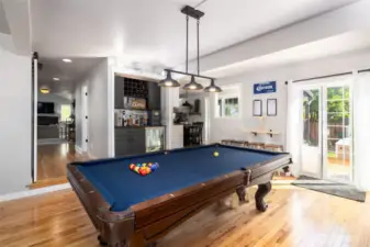 There's a built-in wetbar with a beverage fridge in the family/game room.