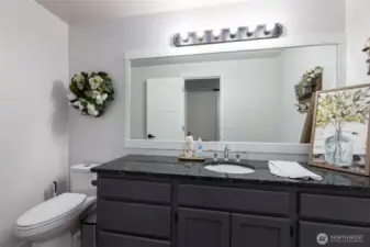 There is a large 1/2 bath on the main level.
