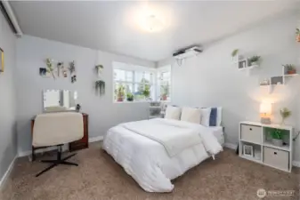 Upstairs bedroom #2 has corner windows for extra light.