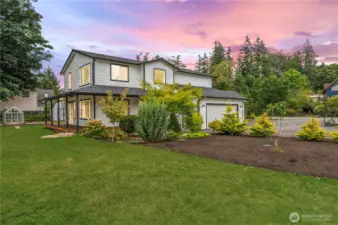 Stunning home with landscaped gardens and large driveway.