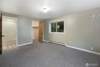 Primary bedroom with access to jack and jill bathroom and a walk in closet.