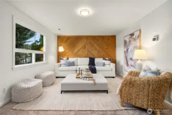 Enter into this super cozy and inviting living room with wood accent wall.