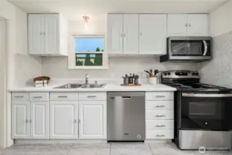 Fully updated kitchen features new/newer appliances.