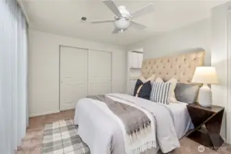 Large primary has its own bathroom and slider to backyard.