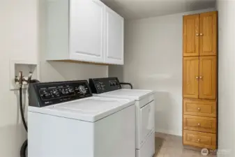 Good sized laundry space has lots of storage with potential to add more.
