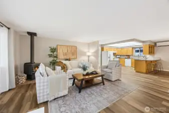 Cozy front room with cozy free standing wood stove.