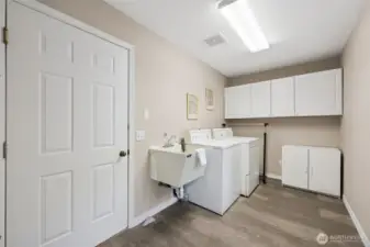 Utility room off kitchen with access to garage.