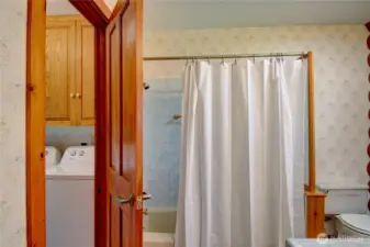 Primary bath looking into laundry room.