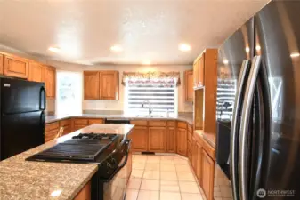 kitchen area with two refrigerators