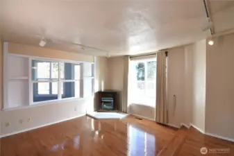 living room with fireplace overlooking backyard deck