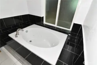 bathtub in primary bathroom