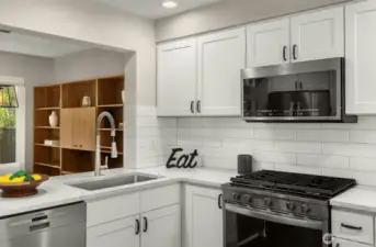 Stylish backsplash and stainless gas stove