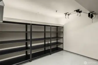 finished 2-car garage goes beyond parking—complete with epoxy floors & built-in storage