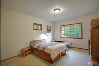 Spacious guest bedroom located in the back of the house for privacy.