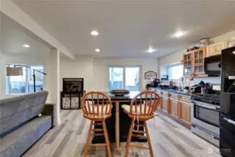 The lower level second kitchen has an island for casual dining.