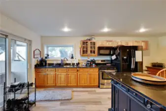 The lower level second kitchen has quality cabinetry.