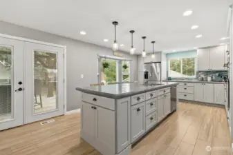 Gorgeous remodeled chef's kitchen with stainless steel appliances. Large island has pullouts and even USB and electric outlets for your devices!