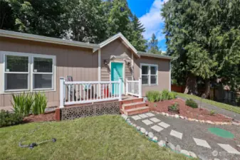 1026 SQ FT move in ready MFH- love the covered front door, cheery front deck & bright front door!