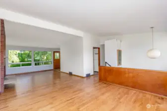 Living room looking to back of home and kitchen.