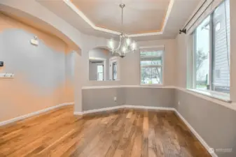 Dining room with beautiful archways and tons of natural lighting.