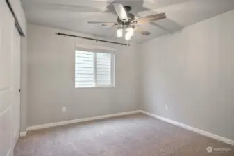 4th bedroom upstairs with ceiling fan.