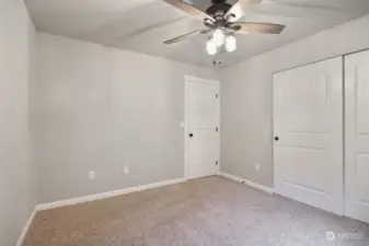 4th bedroom upstairs with ceiling fan.