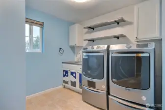 Convenient full sized laundry room on upper level with luxury Maytag washer & dryer.