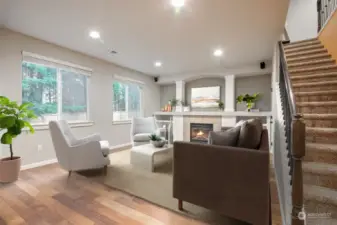 Living room with gas fireplace and tons of natural lighting.  Virtually Staged.