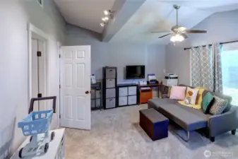 Bonus room with ceiling fan, attached 3/4 bathroom, laundry room and access to covered patio area through the sliding glass door. Could be used as a 4th bedroom, guest room, den, rec room, office or hobby room.