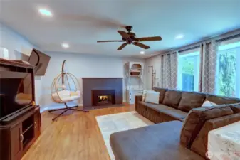 Bright and spacious living room with large bay window. Cozy gas fireplace was just serviced and cleaned.