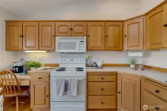 With generous counter space, ample cabinetry, and an eat-in breakfast nook, this space blends function and charm.