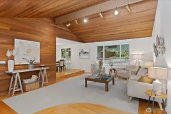 Vaulted ceilings in formal living room leading to dining room.