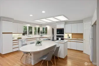 Kitchen with central island and eating space.