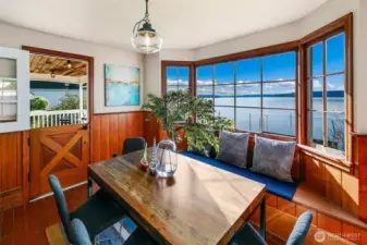With salt-kissed breezes drifting through the Dutch door and sunlight pouring across handcrafted millwork, this waterside dining space is both grounding and expansive. Panoramic windows frame the Salish Sea like living art, while the built-in banquette invites slow mornings, long lunches, and sunset suppers in true Browns Point style.