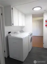 LAUNDRY AREA HAS OVERHEAD STORAGE NEXT TO PRIMARY BEDROOM ENTRY. APPLIANCES STAY WITH HOME.