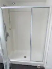 WALK-IN SHOWER W/ GRAB BARS.