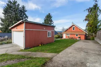 Large powered detached garage/shop with it's own driveway