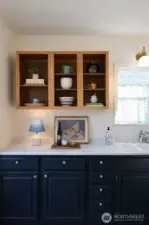 Open shelving and repainted cabinets.