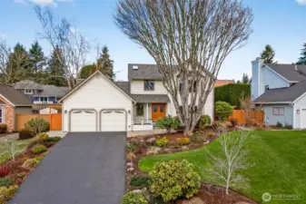 A balanced front elevation with a welcoming covered entry and a landscaped yard that feels open and usable. The side gate and fencing placement support privacy while keeping the exterior low maintenance.