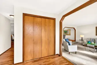 A practical entry with updated flooring (2026) and a spacious coat closet for everyday organization. The arched opening creates a graceful flow into the main living spaces.