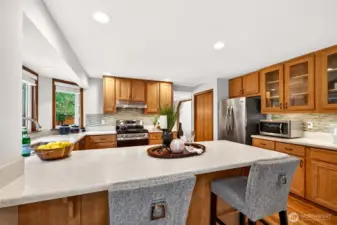 A welcoming gathering hub anchored by the large peninsula and a well planned cooking zone with a gas range and stylish backsplash. Updated appliances add confidence and convenience for day to day living.