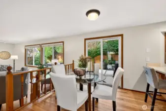 Casual dining area with direct access to the deck, creating an easy indoor to outdoor connection for meals, grilling, and relaxed evenings. The nearby rail overlook keeps the main level feeling open and connected.