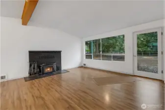 Living area with fireplace and vaulted ceilings