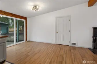 Eating area right next to kitchen. Room for a large table