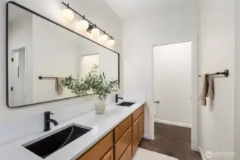 5 piece double vanity bathroom with a private door for toilet